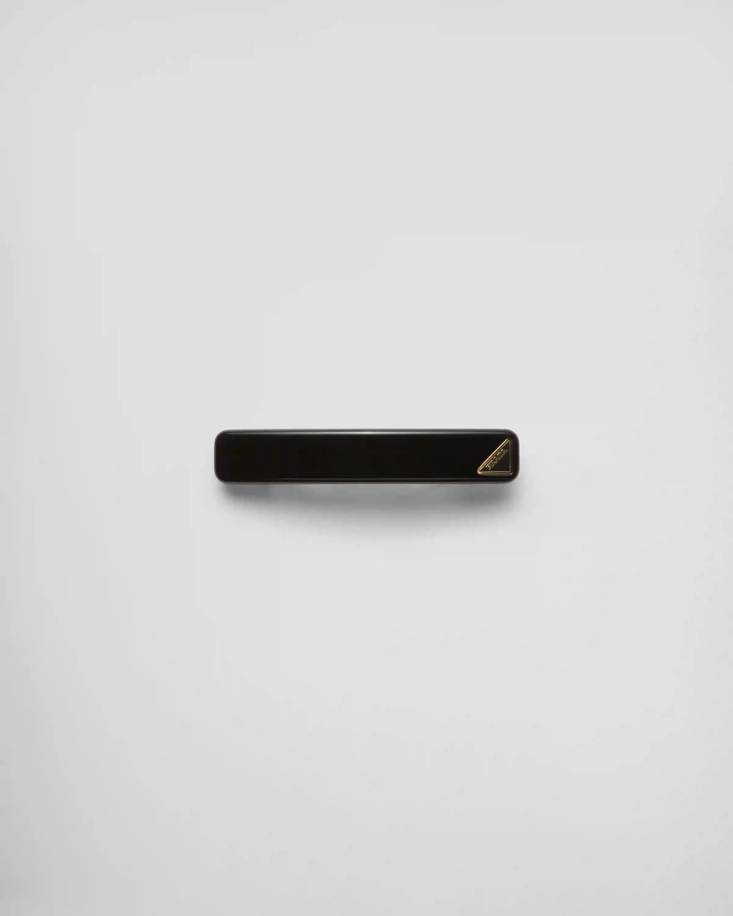 Hair clip with triangle logo